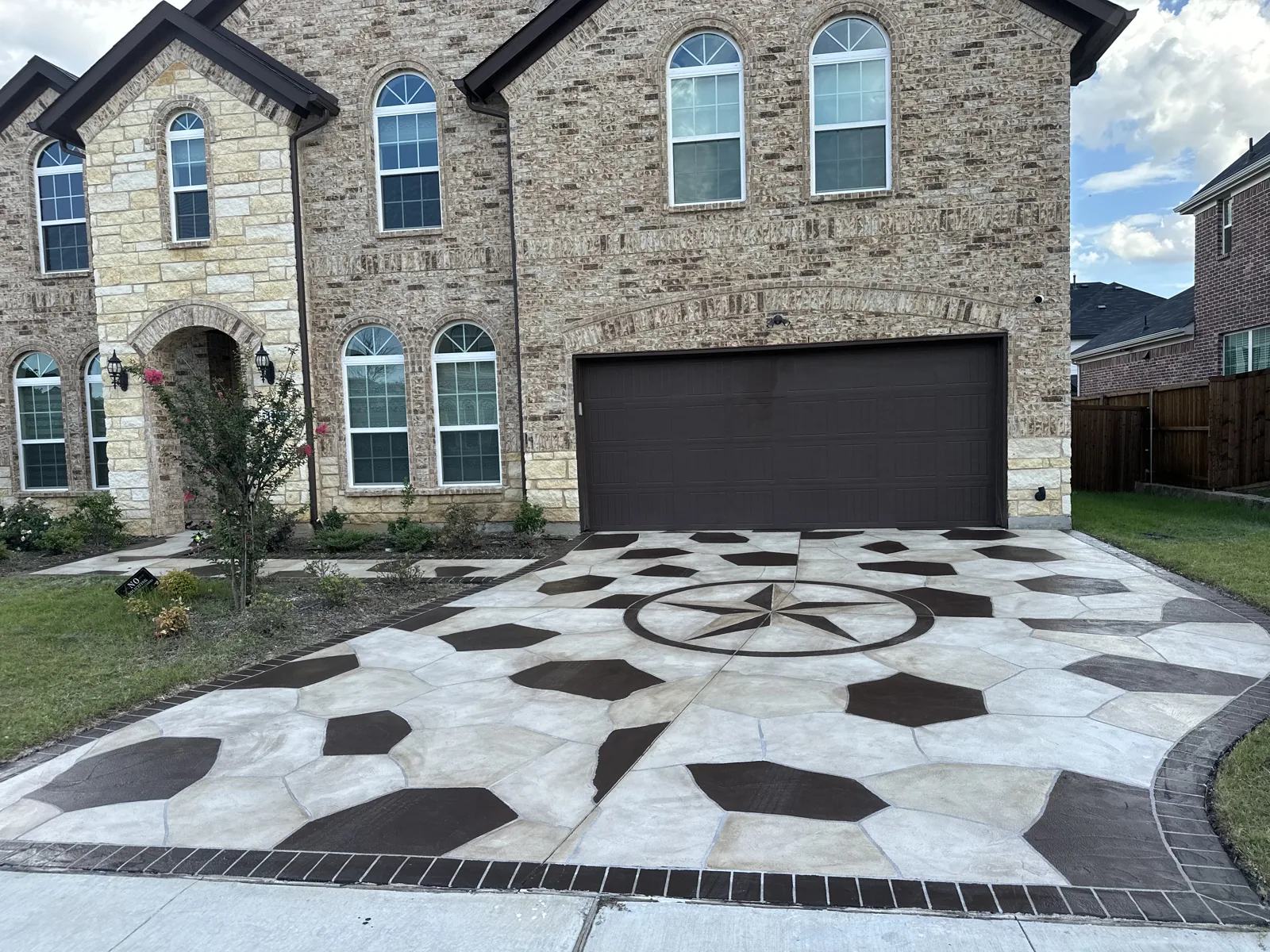Finished stamped concrete patio with outdoor seating at golden hour in Dallas, TX